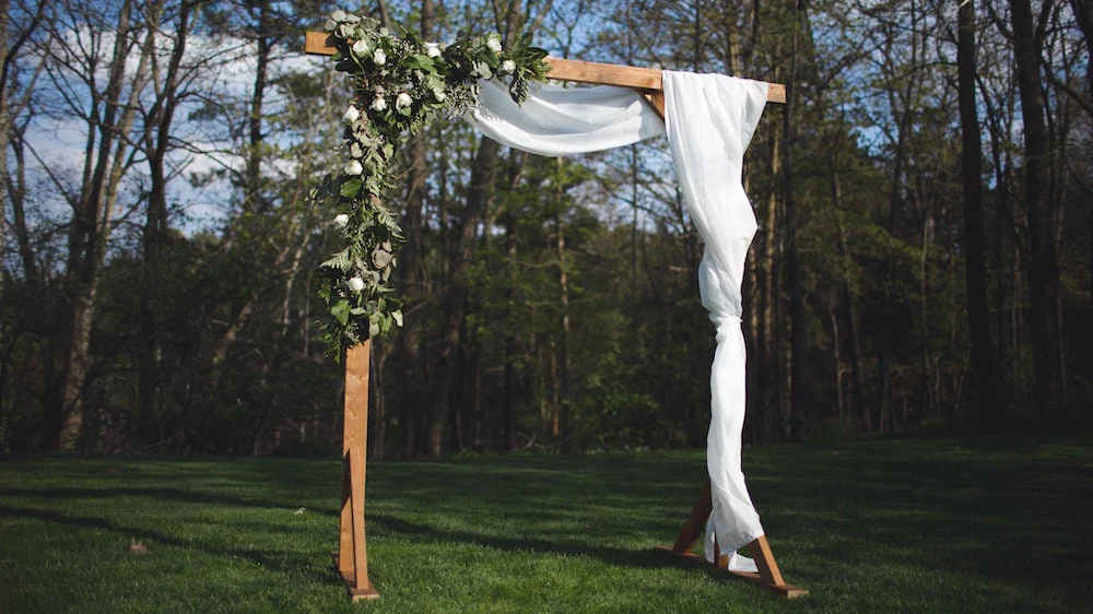 DIY Wedding Decor - Wooden Ceremony Arch with flowers and white material