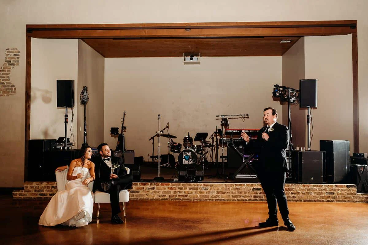 The Royal Dukes playing as the couple watch from the floor