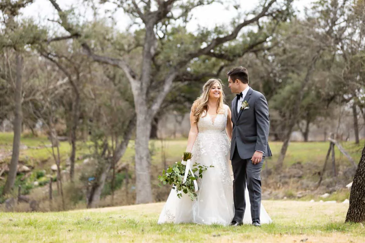Frances and Raleigh together under the oaks after the ceremony
