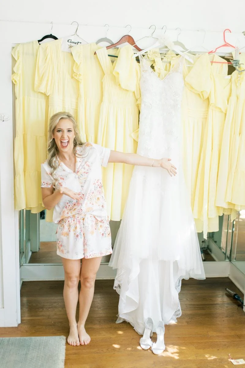Sara Kathryn with her gown among the yellow bridesmaid dresses