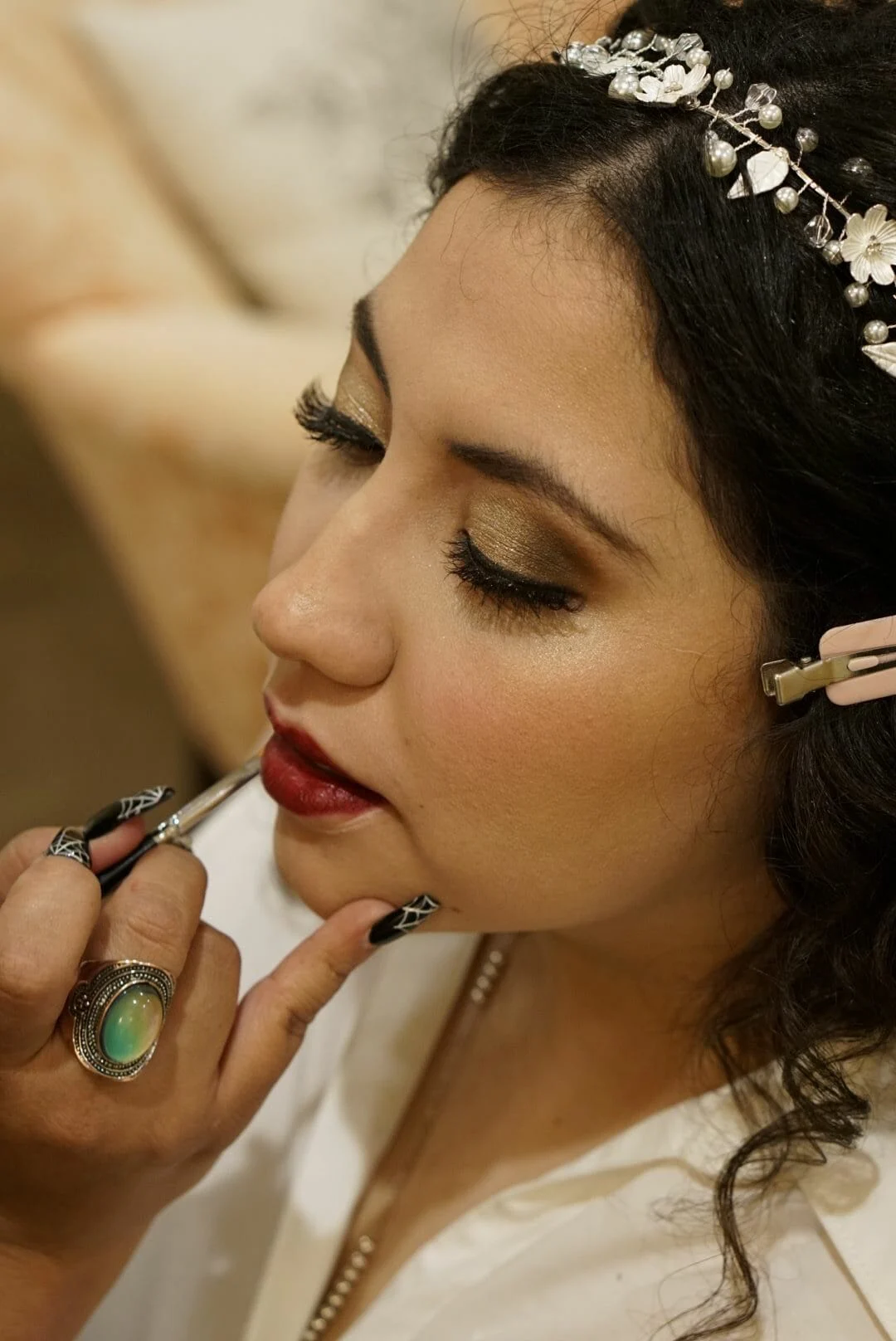 Christina having her lipstick done before the ceremony
