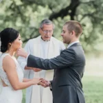 A Hill Country wedding officiant officiating a wedding ceremony