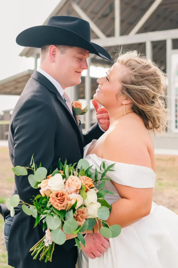 Clay and Hannah Hebert outside the chapel at The Allen Farmhaus in the Texas Hill Country
