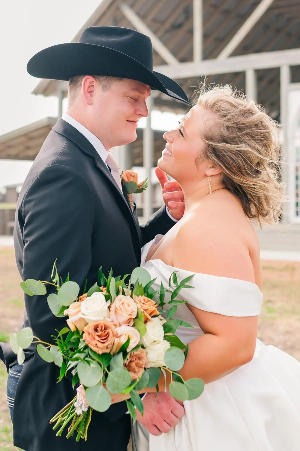 Clay & Hannah, the October Featured Bride & Groom posing on their big day