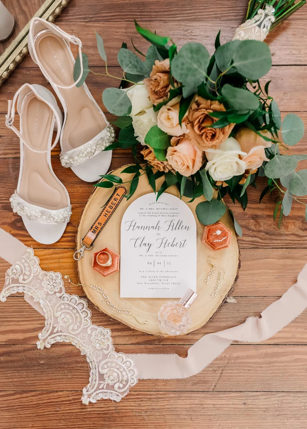 An aesthetic look at the wedding invitation, bouquet, and wedding shoes for October Featured Bride & Groom Hannah & Clay Hebert