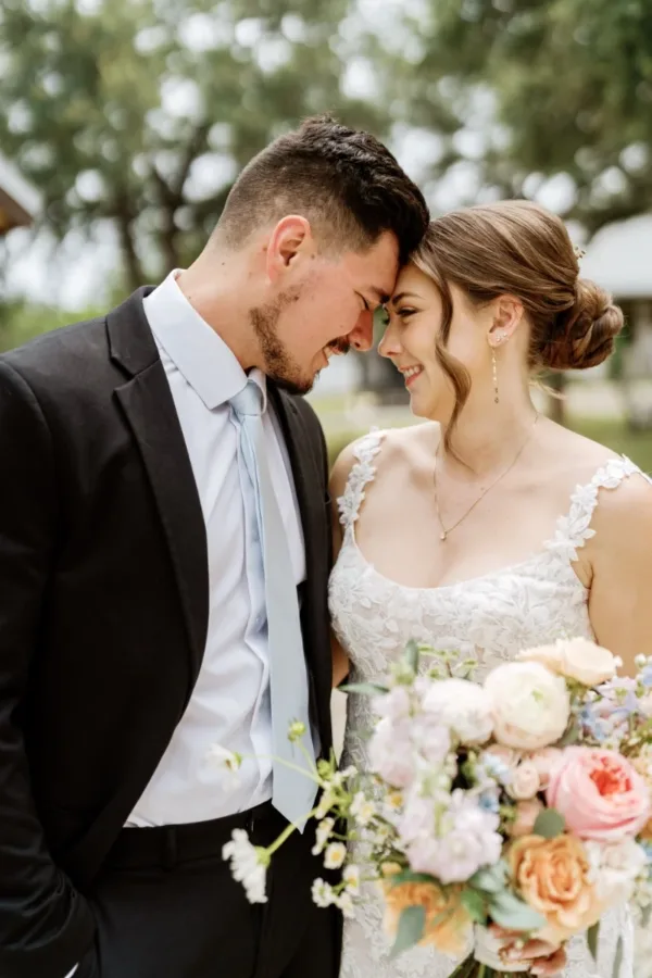 Katie and Alex Borremans forehead to forehead at Stoney Creek, their Texas Hill Country wedding venue