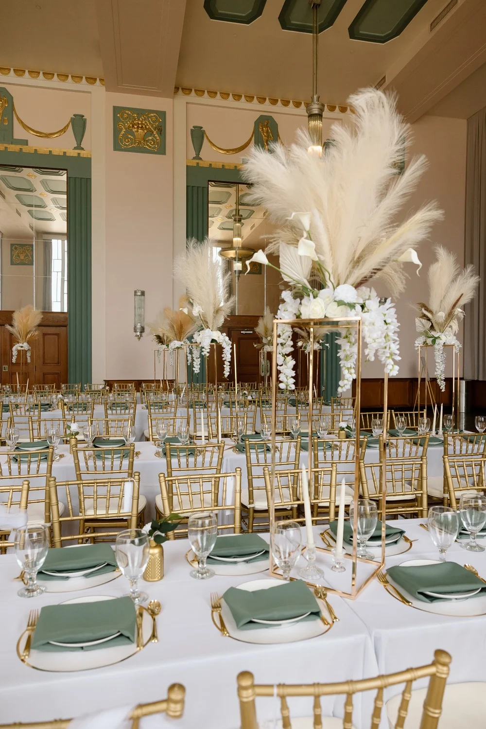 Meinders Hall of Mirrors set for the reception with tall pampas grass centerpieces