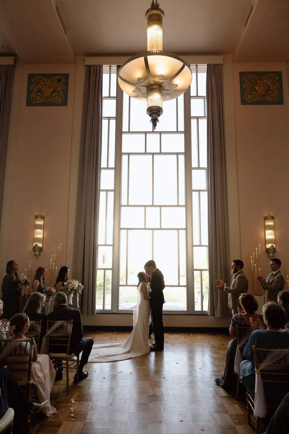 Ceremony beneath the tall art deco window at the Civic Center Music Hall