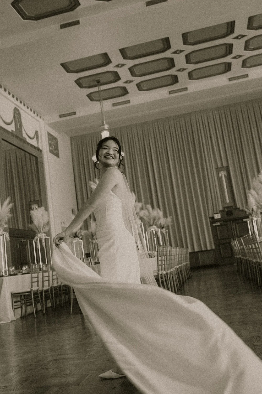 Merribelle twirls her long train in the Meinders Hall of Mirrors ballroom