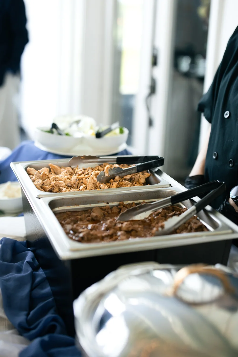 Chafing dishes on the reception buffet catered by River City Catering