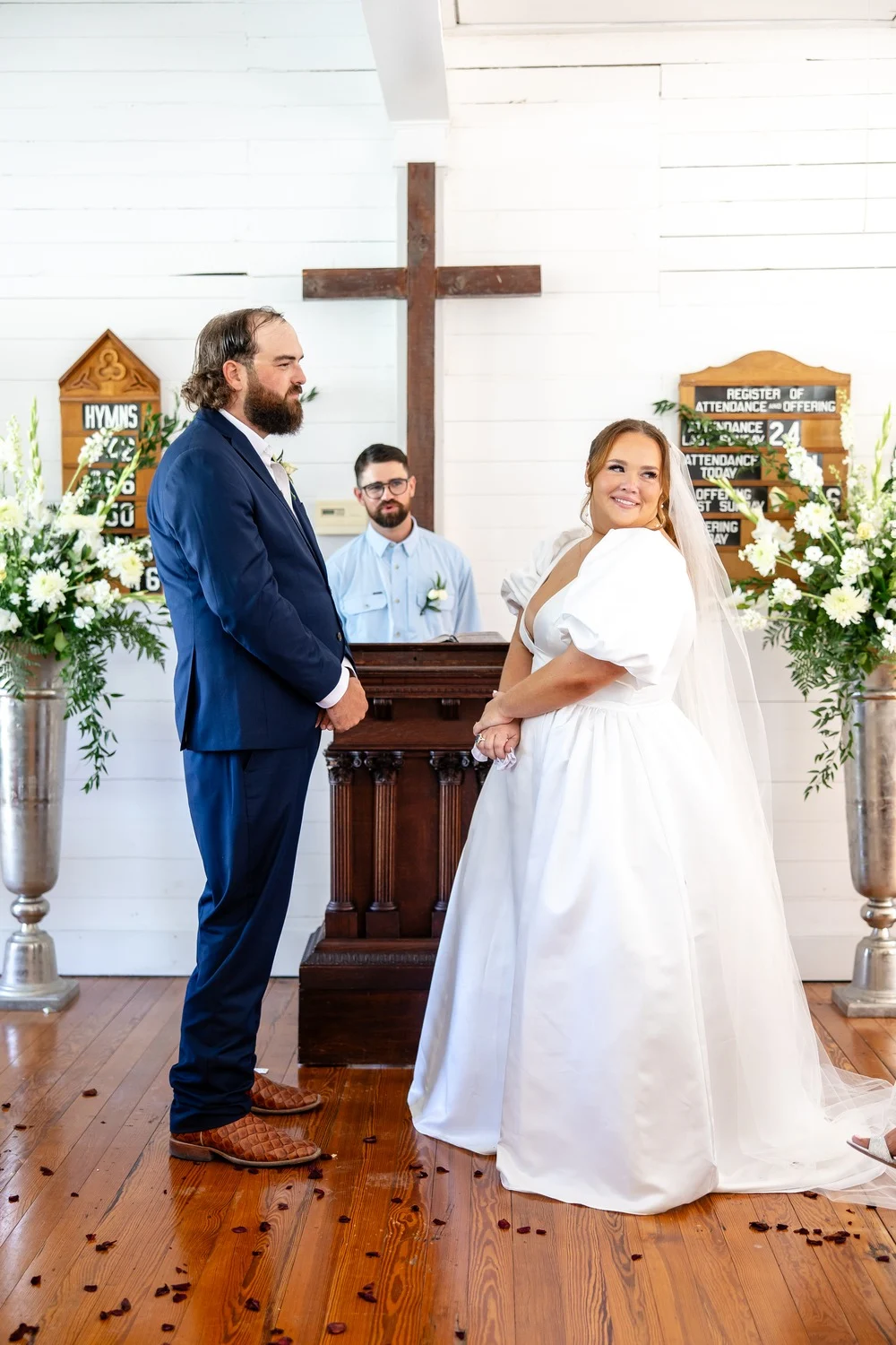 Kolby and Ryan at the altar of The First Church during their ceremony