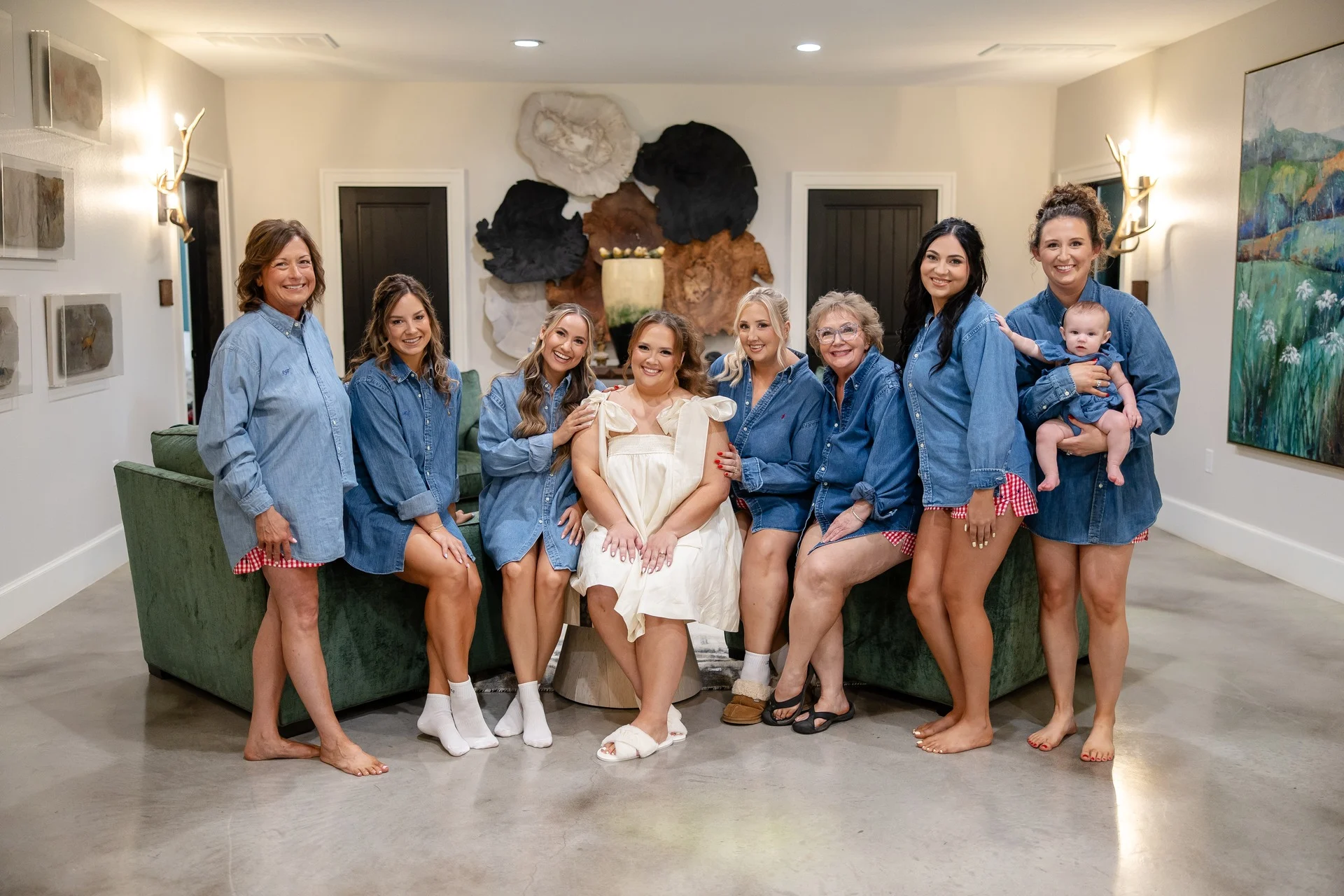 The bride with her mom and bridesmaids in thrifted denim button-downs