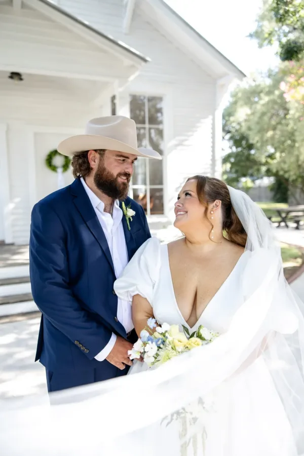 Kolby and Ryan Hensley outside the white chapel on their wedding day